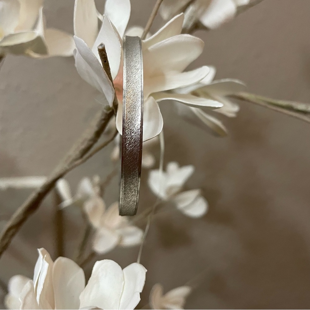 Brushed silver tone Trifari M bangle bracelet.